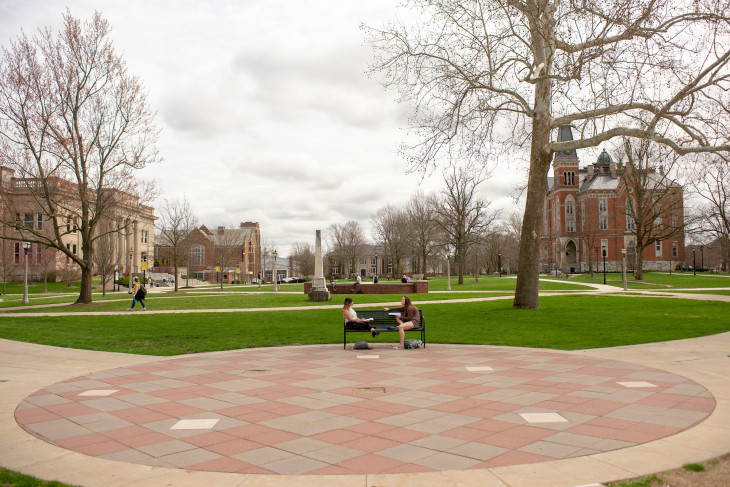 students sitting in academic quad